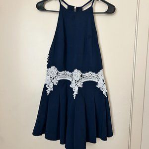 Navy Blue Halter Neck Romper with White Lacy Detail and Open Back